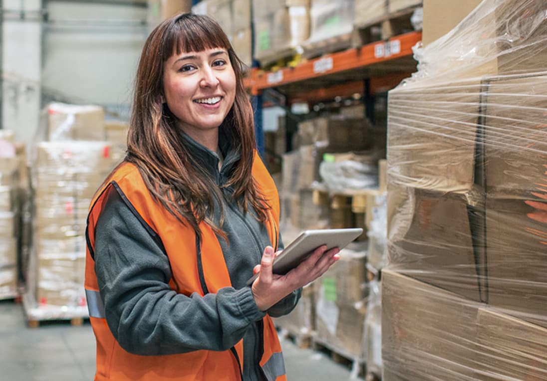 Female warehouse working checking inventory