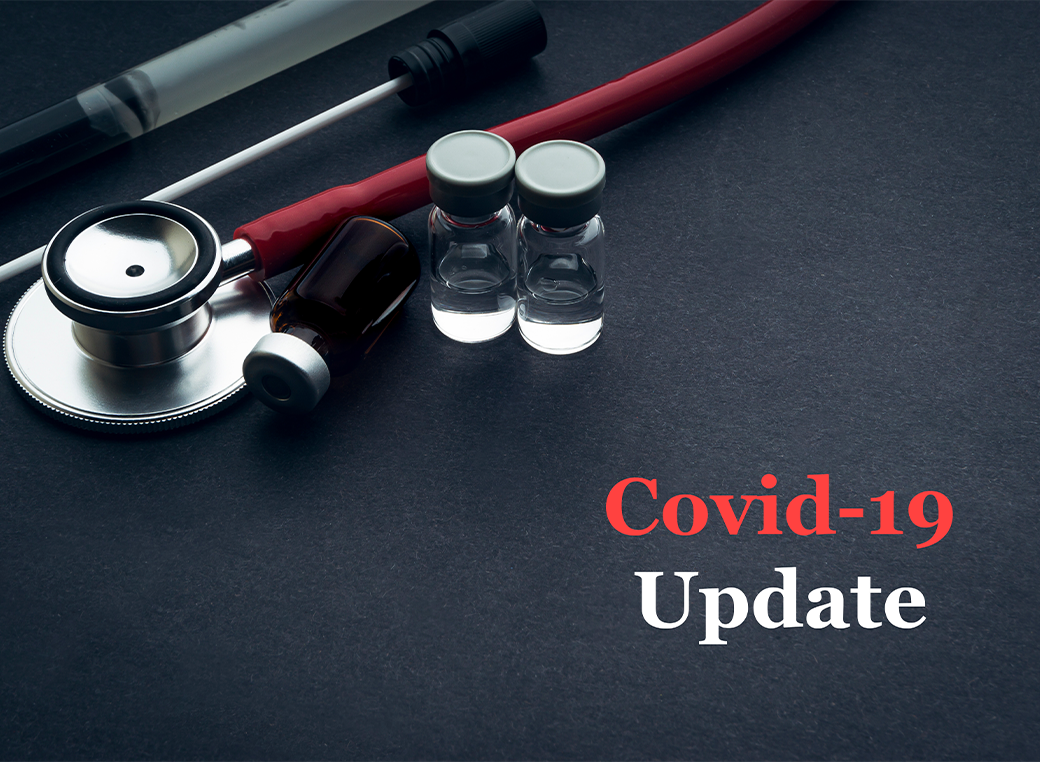 COVID-19 or CORONAVIRUS UPDATE text with stethoscope, medical swab and vial on black background.