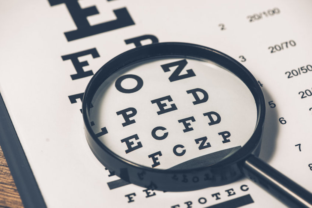 Closeup of eye test chart and alphabet - optical medicine for healthy eye closeup with optical glasses.