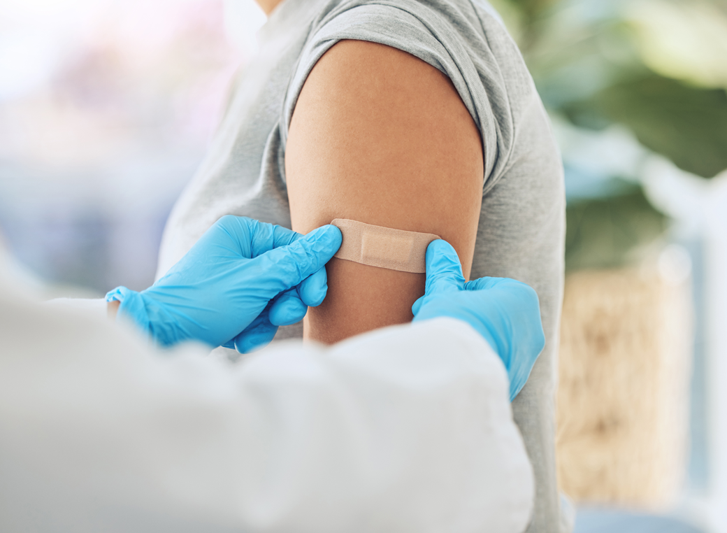 Patient receiving bandage.