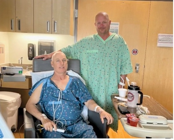 Two men getting ready for a kidney transplant. 