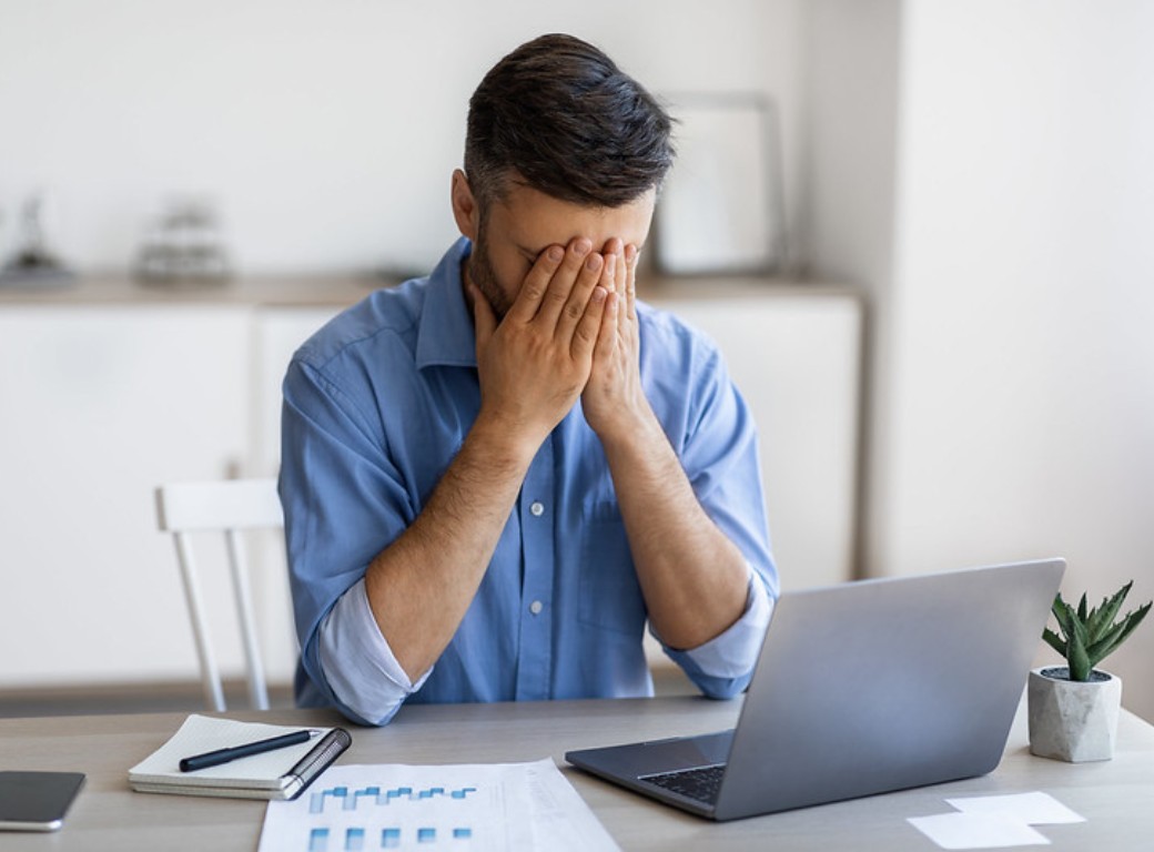 A man at a laptop